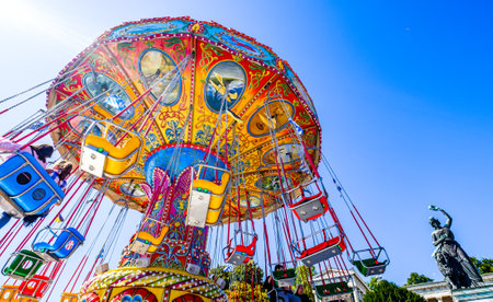 munich, Germany - September 21: the oktoberfest - carousels and people at the world greatest annual fair on september 21, 2019 in munichのeditorial素材