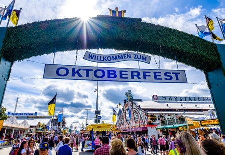 Munich, Germany - September 27: visitors, beertents and fairground rides on the oktoberfest in munich at September 27, 2019のeditorial素材