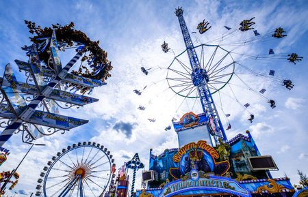 Munich, Germany - September 27: visitors, beertents and fairground rides on the oktoberfest in munich at September 27, 2019のeditorial素材