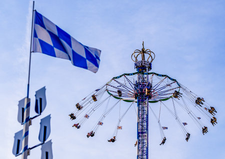Munich, Germany - September 28: visitors, beertents and fairground rides on the oktoberfest in munich at September 28, 2019のeditorial素材