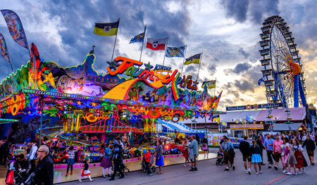 Munich, Germany - September 27: visitors, beertents and fairground rides on the oktoberfest in munich at September 27, 2019のeditorial素材