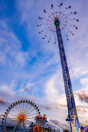 Munich, Germany - September 27: visitors, beertents and fairground rides on the oktoberfest in munich at September 27, 2019のeditorial素材