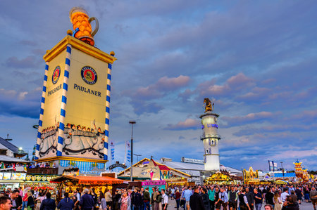 Munich, Germany - September 27: visitors, beertents and fairground rides on the oktoberfest in munich at September 27, 2019のeditorial素材