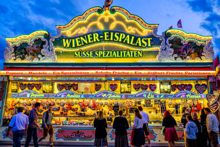 Munich, Germany - September 27: visitors, beertents and fairground rides on the oktoberfest in munich at September 27, 2019のeditorial素材