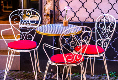table and chairs at a cafe in viennaの写真素材