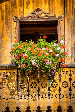 typical bavarian balcony at an old farmhouseの写真素材