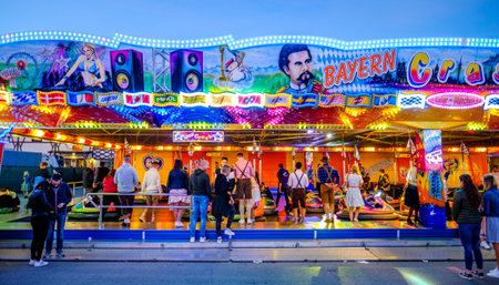 Munich, Germany - September 28: visitors, beertents and fairground rides on the oktoberfest in munich at September 28, 2019のeditorial素材