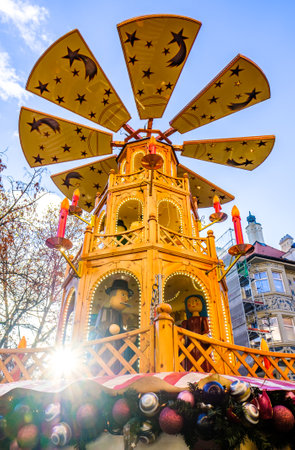 Munich, Germany - December 3: people and typical sales booth at the christmas market on December 3, 2019 in Munich, Germanyのeditorial素材