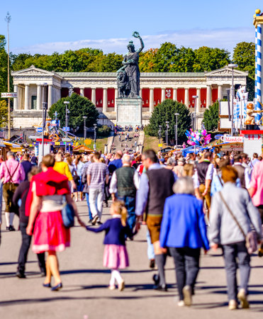 Munich, Germany - October 1: people and fairground rides at the biggest folk festival in the world - the oktoberfest on october 1, 2019 in munich.のeditorial素材