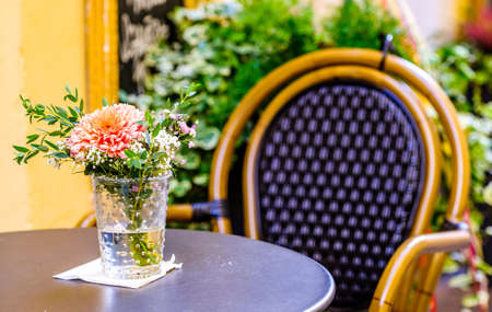 table and chairs at a cafe in vienna