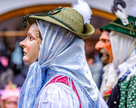 Mittenwald, Germany - February 20: participants of a parade with traditional disguise with large wooden masks and historic costumes called 'maschkera' on February 20, 2020 in Mittenwaldのeditorial素材