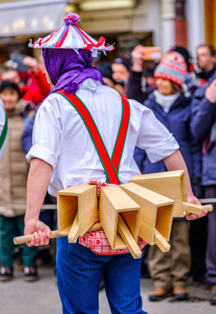 Mittenwald, Germany - February 20: participants of a parade with traditional disguise with large wooden masks and historic costumes called 'maschkera' on February 20, 2020 in Mittenwaldのeditorial素材
