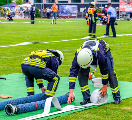 Murnau, Germany - June 24: fire fighter at an exercise with water pump in Murnau on June 24, 2017のeditorial素材