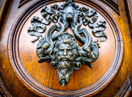 old doorknocker at a door
