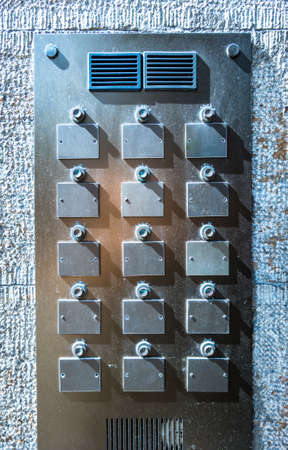 old bell buttons at a wallの写真素材