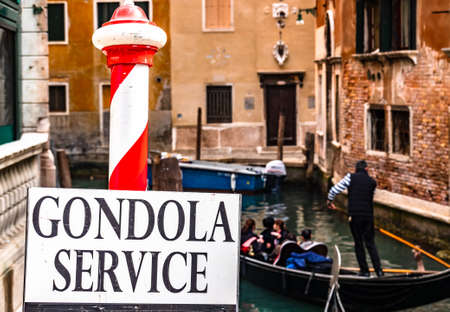 typical gondola service sign in venice - italyの写真素材