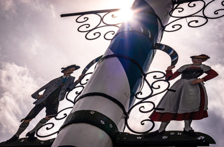 Miesbach, Germany - May 7: typical bavarian maypole with old paintings at the old town of Miesbach on May 7, 2019のeditorial素材
