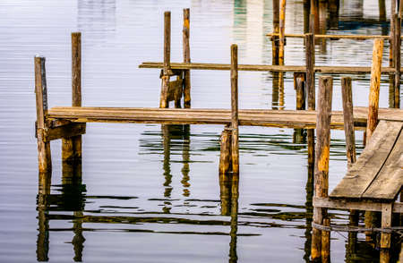 old wooden jetty at a lake - bavariaの写真素材