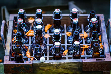 old bottles in wooden boxesの写真素材