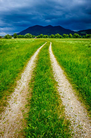 old country road at the alps - bavariaの写真素材