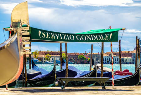 typical gondola sign in venice - italy - translation: gondola serviceの写真素材