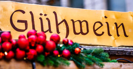 typical old sign at a german christmas market - translation: hot wine punchの写真素材