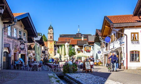 Mittenwald, Germany - September 27: historic buildings and tourists at the famous old town of Mittenwald on September 27, 2020のeditorial素材