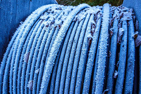 frosted tube at a construction site in winterの写真素材