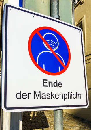 no mandatory face masks sign in germany - translation: no mandatory face masksの写真素材