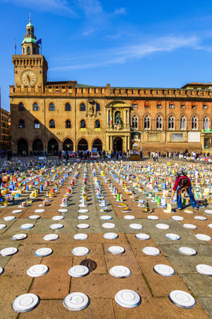 Bologna, Italy - October, 10: Participants in the action "riempi il piatto vuoto" (translation: "fill the empty plate") by Caritas and CEFA while collecting food for the needy on Piazza Maggiore in Bologna on October 10, 2020のeditorial素材