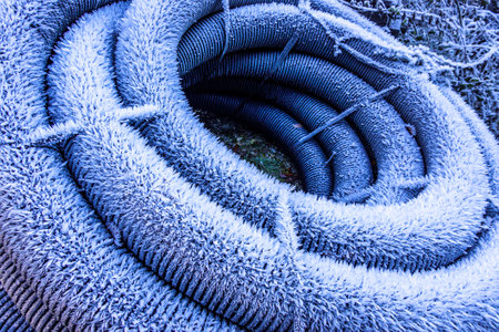 frosted tube at a construction site in winterの写真素材