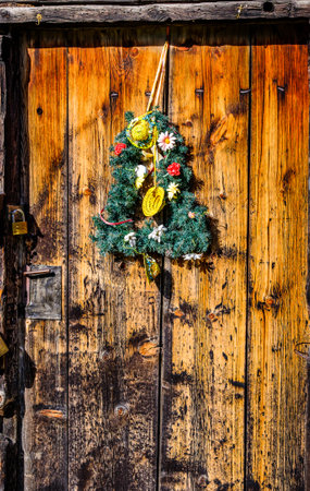 typical old wreath at a doorの写真素材