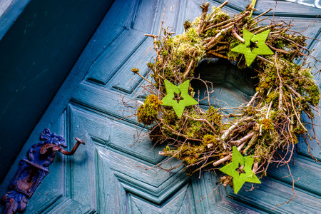typical old wreath at a doorの写真素材