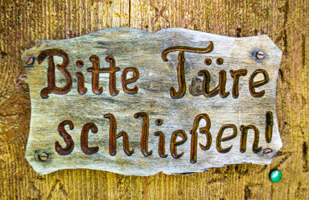 old sign in germany - translation: "close the door"の写真素材