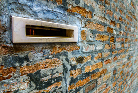 old letterbox at a door - photo