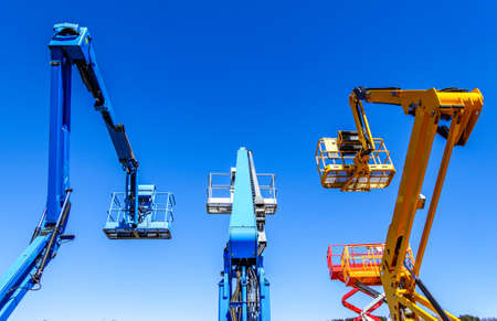 modern lifter in front blue sky - cherry pickerの写真素材