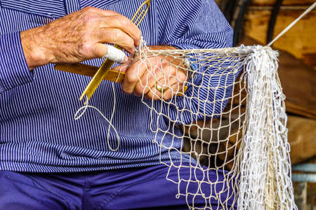 knotting a fishing net - photo
