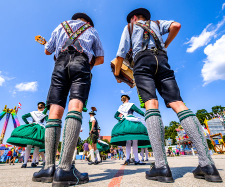 typical bavarian dance group in front of blue skyのeditorial素材