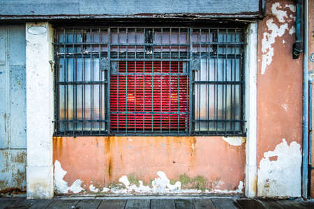 old wooden window at a facade - photoの写真素材