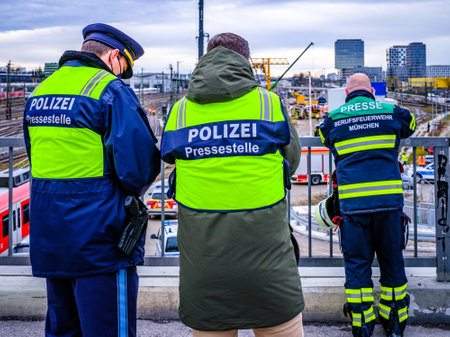 Munich, Germany - December 1: Police officer of the press office in front of an accident area whrer a bomb from WWII exploded at the Donnersberger BrÃ¼cke in Munich on December 1, 2021のeditorial素材