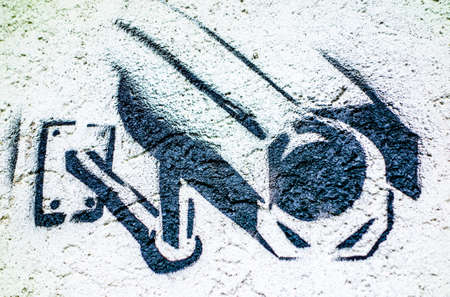 typical security camera graffiti at a wallの写真素材