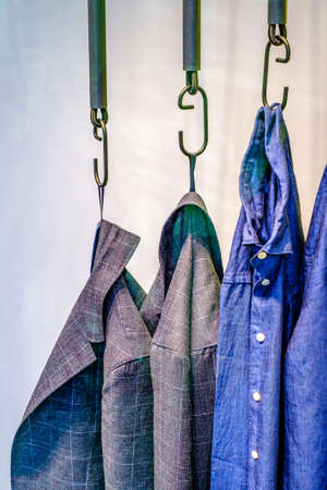 clothes hanging at a clothes rail - photoの写真素材