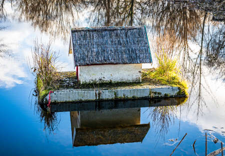 typical wooden bird house - photoの写真素材