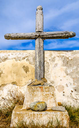 beautiful antique cross at a cemeteryの写真素材