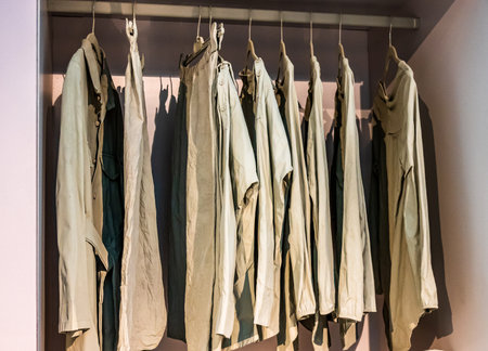 clothes hanging at a clothes rail - photoの写真素材