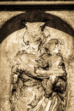 beautiful historic relief at a cemetery - photo