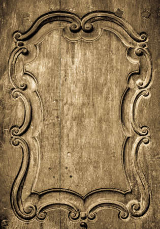 old wooden ornament at a historic doorの写真素材