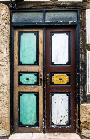 old wooden door at a historic building - photoの写真素材