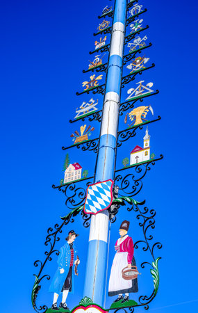 Starnberg, Germany - February 9: typical old bavarian maypole with antique paintings in Starnberg on February 9, 2022のeditorial素材