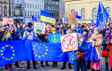 Munich, Germany - February 27: demonstrators against the invasion of russia into ukraine in the city...
